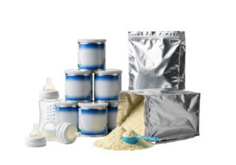 Stacked baby formula cans, foil bag, spilled powder, blue scoop, two baby bottles on white reflective studio background. Concept for infant nutrition product advertisement