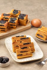 Lapis legit is a multi-layered Indonesian cake inherited from the Dutch colonial era, often served...