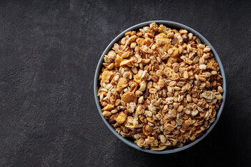 Granola Cereal in Bowl on Dark Background Healthy Breakfast Top View Copy Space