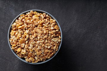 Granola Cereal in Bowl on Dark Background Healthy Breakfast Top View Copy Space