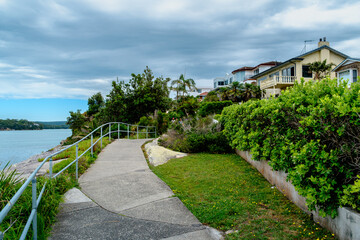 Taken at Hungry Point Reserve on the Cliff Top Walk in December 2025, this photo shows the coastline views toward Bundeena and Maianbar, with people enjoying hiking and coastal life.