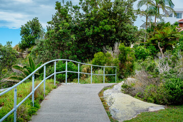 Taken at Hungry Point Reserve on the Cliff Top Walk in December 2025, this photo shows the coastline views toward Bundeena and Maianbar, with people enjoying hiking and coastal life.