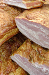 Smoked pork belly or brisket on the counter of a butcher shop