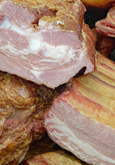 Smoked pork belly or brisket on the counter of a butcher shop