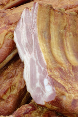 Smoked pork belly or brisket on the counter of a butcher shop