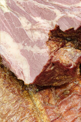 Smoked pork belly or brisket on the counter of a butcher shop