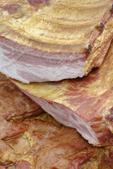 Smoked pork belly or brisket on the counter of a butcher shop