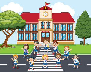 Group of happy school children on a crosswalk in front of a school