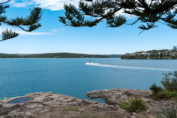 Taken at Hungry Point Reserve on the Cliff Top Walk in December 2025, this photo shows the coastline views toward Bundeena and Maianbar, with people enjoying hiking and coastal life.