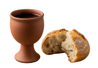 Rustic clay chalice brimming with deep red wine, two broken artisanal bread pieces on burlap, open blurred Bible, soft diffused light. Concept of Christian communion