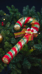 Christmas candy cane ornament on decorated Christmas tree