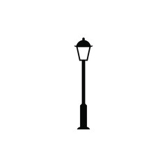 A black silhouette illustration of a traditional street lamp post against a clean white background