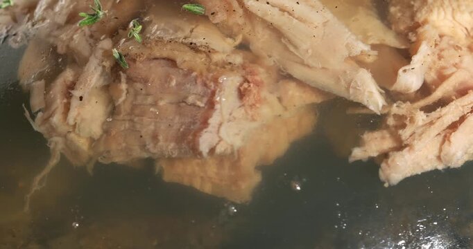 Aspic jellied meat on a dark background. Close-up footage on the rotating table.