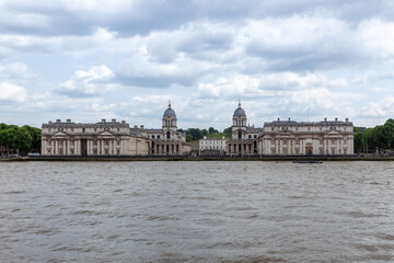 Historic Old Royal Naval College in Greenwich, London, overlooking the Thames River.