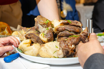 Close-up of national Kazakh dish Beshbarmak, appetizing meat