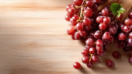 A cluster of fresh, juicy red grapes alongside green leaves creates a refreshing and vibrant visual, representing health, nature, and delicious flavor.