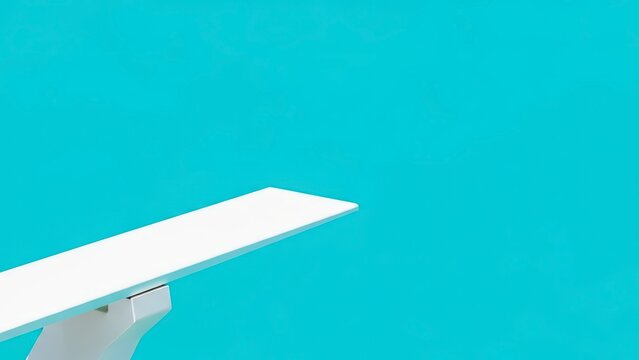 White Diving Board Overlooking a Bright Blue Pool.