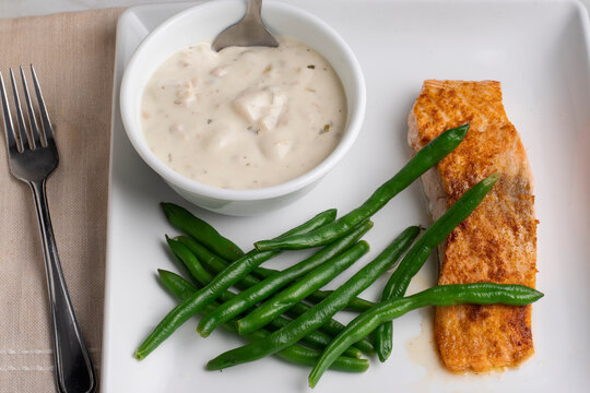baked season salmon  with green beans and chowder