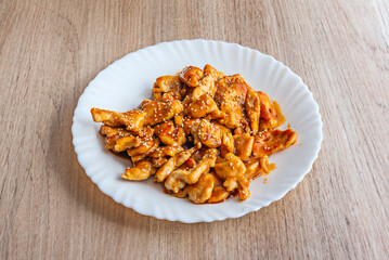 A dish of great chicken cooked with teriyaki sauce