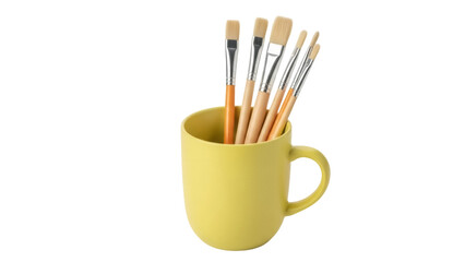 Fototapeta premium Isolated mustard mug with paintbrushes, art tools for drawing and painting supplies