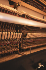 Upright piano details in cozy indoor night lighting