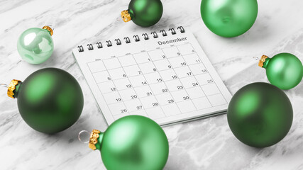 Calendar December with green christmas ball decoration on marble table background