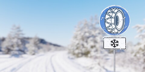 Snow chains required sign in front of snowy winter road background with snow with copy space