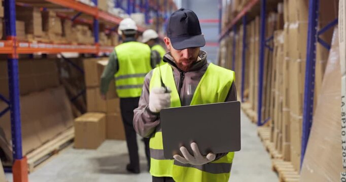 Warehouse workers manage inventory using laptop and radio. Supervisor directs staff with a box near tall shelves for accurate counts and timely shipping. Clear logistics workflow and teamwork.