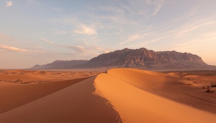 Fototapeta premium Quiet desert scene with expansive sky in Morocco, ideal for editorial header backgrounds
