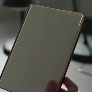 Notebook standing upright in workspace