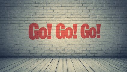 Uplifting words painted on a white brick wall, designed to inspire determination and resilience