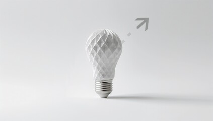 Light bulb crafted from paper denoting conceptual thinking, set against a white backdrop, useful for innovation or brainstorming visuals