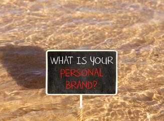 Naklejka premium What is your personal brand symbol. Concept words What is your personal brand on beautiful blackboard. Beautiful Red sea water background. Business what is your personal brand concept. Copy space.