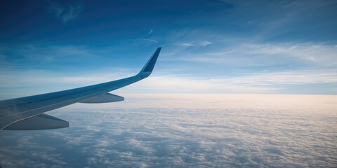 Obraz premium Passenger perspective of a distant landscape through an aircraft window, highlighting air travel, International Day of Human Space Flight