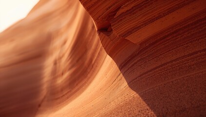 Detailed view of sandstone sediment strata on an obelisk illuminated by sunlight, focusing on natural preservation