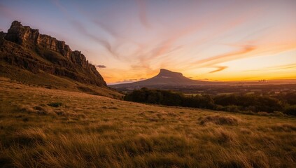 Scenic view of Salisbury Crags and Arthurs Seat at sunset, ideal for landscape imagery