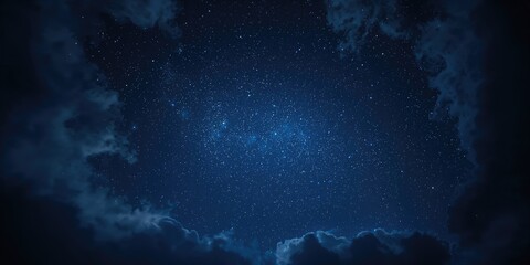 Obraz premium Dark blue nighttime sky with stars and clouds, ideal for background in celestial-themed design, World Astronomy Day