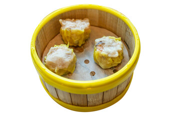 Top view of Pork dumplings in the yellow edge basket, focus selective