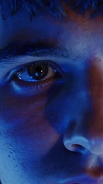 Neon lights illuminate, Reflective gleam accompanies gamer preparing for intense competition, Bright neon illumination surrounds gamer as reflections cast captivating glow before gameplay