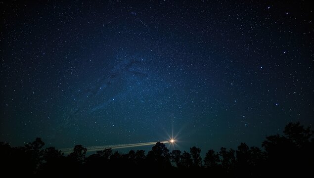 Orion constellation visible overhead with passing aircraft, illustrating aviation and celestial alignment