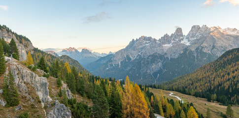 Mountain Plateau Landscape Scene - Prato Piazza Dolomites Italy - Autumn Fall Alpine rolling hills with forests and golden trees - castles, roads and mountains 