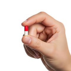 Hand Holding a Small Red and White Medical Capsule Pill