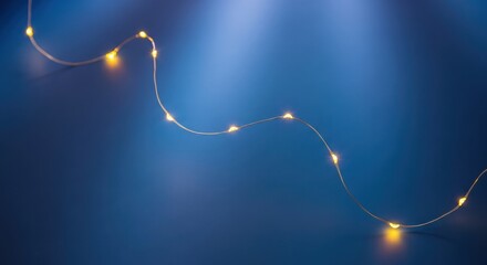 Warm fairy lights glowing on a dark blue background