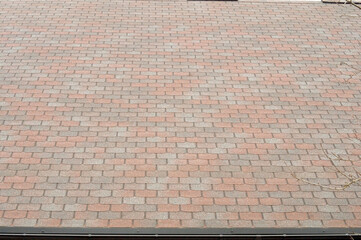 Construction background. Soft tiles on the pitched roof of a residential building.
