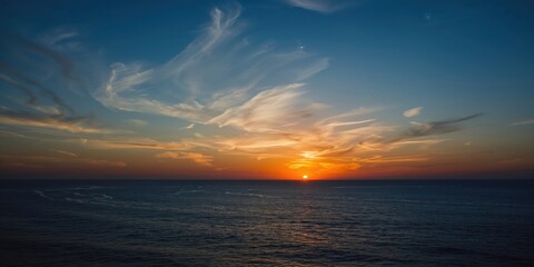 Sunrise on a blue sky with soft clouds, ideal for a serene background in editorial layouts