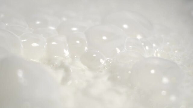 Super Slow Motion Artistic Microfoam Creation Featuring Bright White Bubbles And Subtle Shimmering Effects