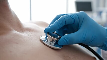 Doctor uses stethoscope to listen to patient's heartbeat and lungs, checking for health issues and diagnosing illness