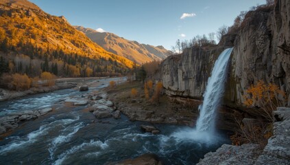 Kuiguk waterfall during sunset in autumn, highlighting water flow and mountain scenery, seasonal change