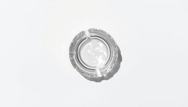 Minimalist glass ashtray with transparent design intended for modern interior settings, emphasizing clarity and functionality