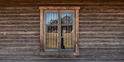Weathered wood window and wall, rustic building exterior emphasizing age and material decay, heritage site preservation